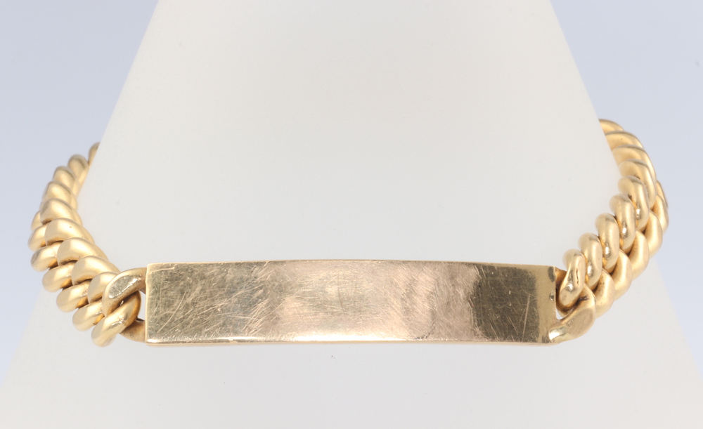 A yellow metal 750 identity bracelet 19 grams