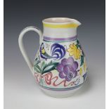 A Poole Pottery mid-Century jug decorated with stylised birds and flowers, monogrammed LEO 18cm