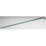 A Victorian green glass walking cane 84cm