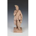 A 19th Century earthenware figure of a standing gentleman holding a bread and a bottle, the base