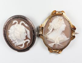 A Victorian yellow metal cameo brooch with a classical lady and dove (cracked), a ditto of Medusa in