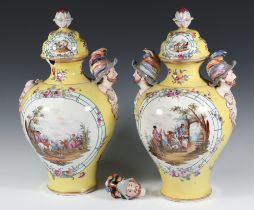 A pair of 19th Century Continental yellow ground 2 handled vases and covers with panels of figures