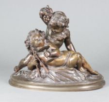 A 19th Century bronze figure group of 2 reclining cherubs raised on a demi-lune base 18cm h x 22cm w