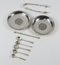 Two Sterling silver coin set dishes, pair of nips, swizzle stick and 5 mustard spoons, 146 grams