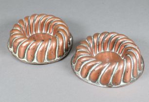 Benham, a pair of Victorian circular squat copper moulds 5cm x 14cm, both with sceptre marks Both