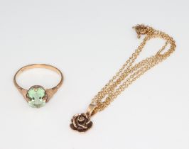 A 9ct yellow gold peridot ring together with a ditto pendant and chain 3.3 grams