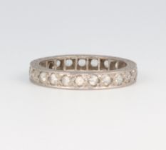 A white metal diamond eternity ring, 3.4 grams, size L