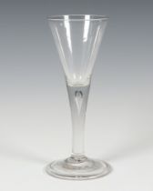 A 19th Century glass cordial with air bubble stem and folded foot 20cm