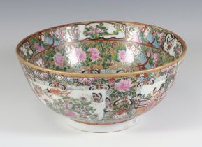 A famille rose Chinese deep bowl decorated with figures in a pavilion enclosed by a band of