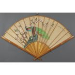 20th Century Japanese study of birds amongst flowers contained in a bamboo faux fan shaped frame