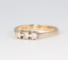 A 9ct yellow gold 3 stone diamond ring approx. 0.15ct, 1.8 grams, size K 1/2