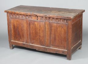 An 18th Century oak coffer with hinged lid, arcaded and panel decoration to the front 78cm h x 139cm