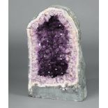 A large and impressive amethyst geode, 54cm h (when pieces are together) x 31cm w This has been