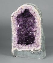 A large and impressive amethyst geode, 54cm h (when pieces are together) x 31cm w This has been