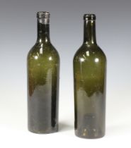 Two 19th Century green glass wine bottles 29cm