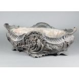 A French 19th/20th Century Rococo style cast bronze boat shaped planter with floral decoration,