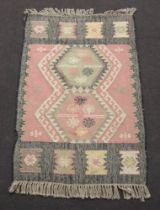 An Indian tan and black ground Kilim rug 98cm x 154cm and 1 other 67cm x 97cm
