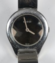 A lady's steel cased Gucci wristwatch on a buckle bracelet