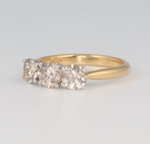 An 18ct yellow gold 3 stone brilliant cut diamond ring, approx. 1.55ct, size M, 3.5 grams