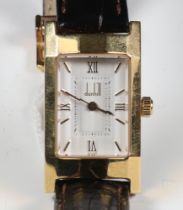 A lady's gilt cased Dunhill wristwatch with leather strap and clasp in original box