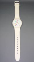 A 1987 Swatch battery operated wall clock in the form of an oversized Swatch wristwatch, having a