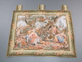 A machine made tapestry panel with seated figures 110cm x 84cm