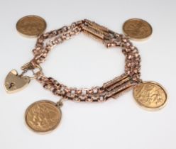 A yellow metal bracelet with a 9ct padlock and 4 half sovereigns - 1909, 1913, 1914 and 1925 in