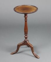 A Georgian style circular mahogany wine table raised on pillar and tripod supports 60cm h x 28cm