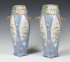 A pair of 1930's Noritake vases with pale blue ground and panels of flowers 30cm