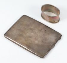 An Art Deco silver engine turned cigarette case Birmingham 1931 with engraved monogram together with