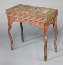 A 19th/20th Century Damascus inlaid card table with swivel top, the interior inlaid a cribbage