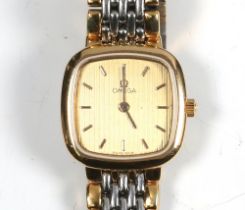 A lady's gold plated Omega wristwatch on a bimetallic bracelet