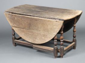 A 17th/18th Century bleached oak oval dropflap gateleg dining table on turned supports 71cm h x 61cm