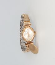 A lady's 9ct yellow gold Rotary wristwatch with 9ct charm on a gold plated bracelet, gross weight