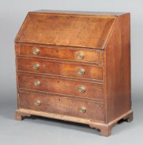 A Georgian oak bureau, the fall front revealing a well fitted interior with pigeon holes and