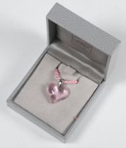 A Lalique pink glass heart shaped pendant 25mm, on a silk pink necklace 72cm, boxed