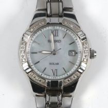 A lady's steel cased Seiko Solar calendar wristwatch on a steel bracelet