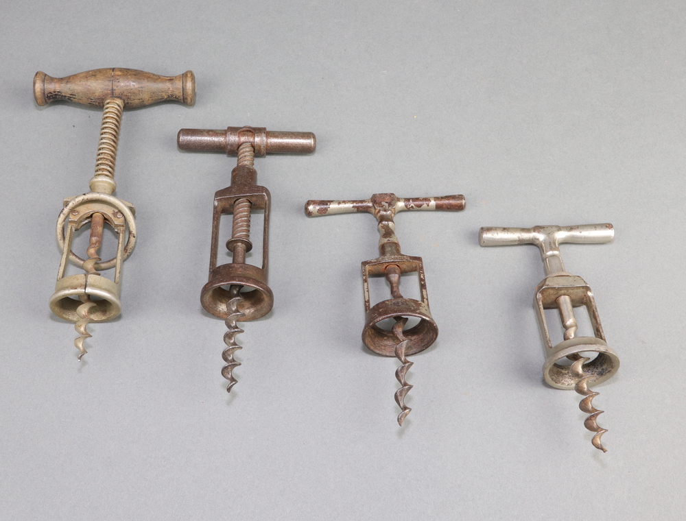 A Surprise corkscrew together with 4 twin pillar corkscrews 1 marked D.R.G.M and 3 19th Century