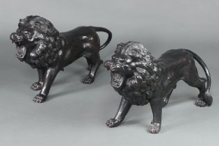An impressive pair of 20th Century cast bronze figures of walking lions 45cm h x 82cm w x 21cm d