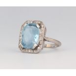 A white metal aquamarine and diamond cocktail ring, the centre stone 15mm x 10mm, 5.1 grams, size K