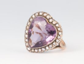 A yellow metal 9ct heart shaped amethyst and seed pearl ring, 5.6 grams, size K