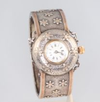 A white metal Edwardian silver bracelet watch with enamelled dial Not in working condition