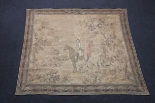 A machine made tapestry wall hanging depicting mounted figures in a wooded area 182cm x 213cm Some