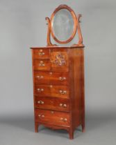 An Edwardian mahogany dressing chest, the top with oval plate mirror above 2 short drawers flanked