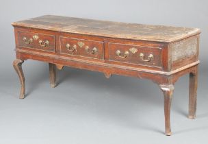 An 18th Century oak dresser fitted 3 drawers with brass swan neck drop handles raised on cabriole