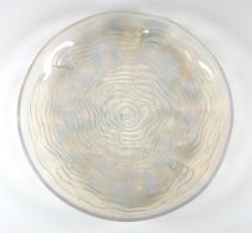 A Lalique opalescent fish bowl with fish amongst waves, etched R LALIQUE 30cm diam.