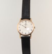 A lady's 9ct yellow gold Omega wristwatch on a leather strap, contained in a 32mm case The winder