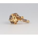 An 18ct yellow gold diamond and sapphire set leopard ring 4.4 grams, size J