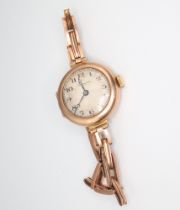 A lady's 9ct yellow gold wristwatch, the dial inscribed James Walker, gross weight including