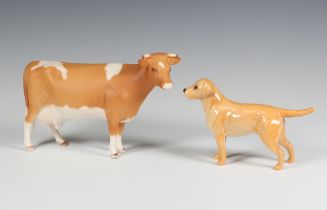 A Beswick Guernsey cow no.1248B matt, modelled by Arthur Greddington 10.8cm, together with a ditto